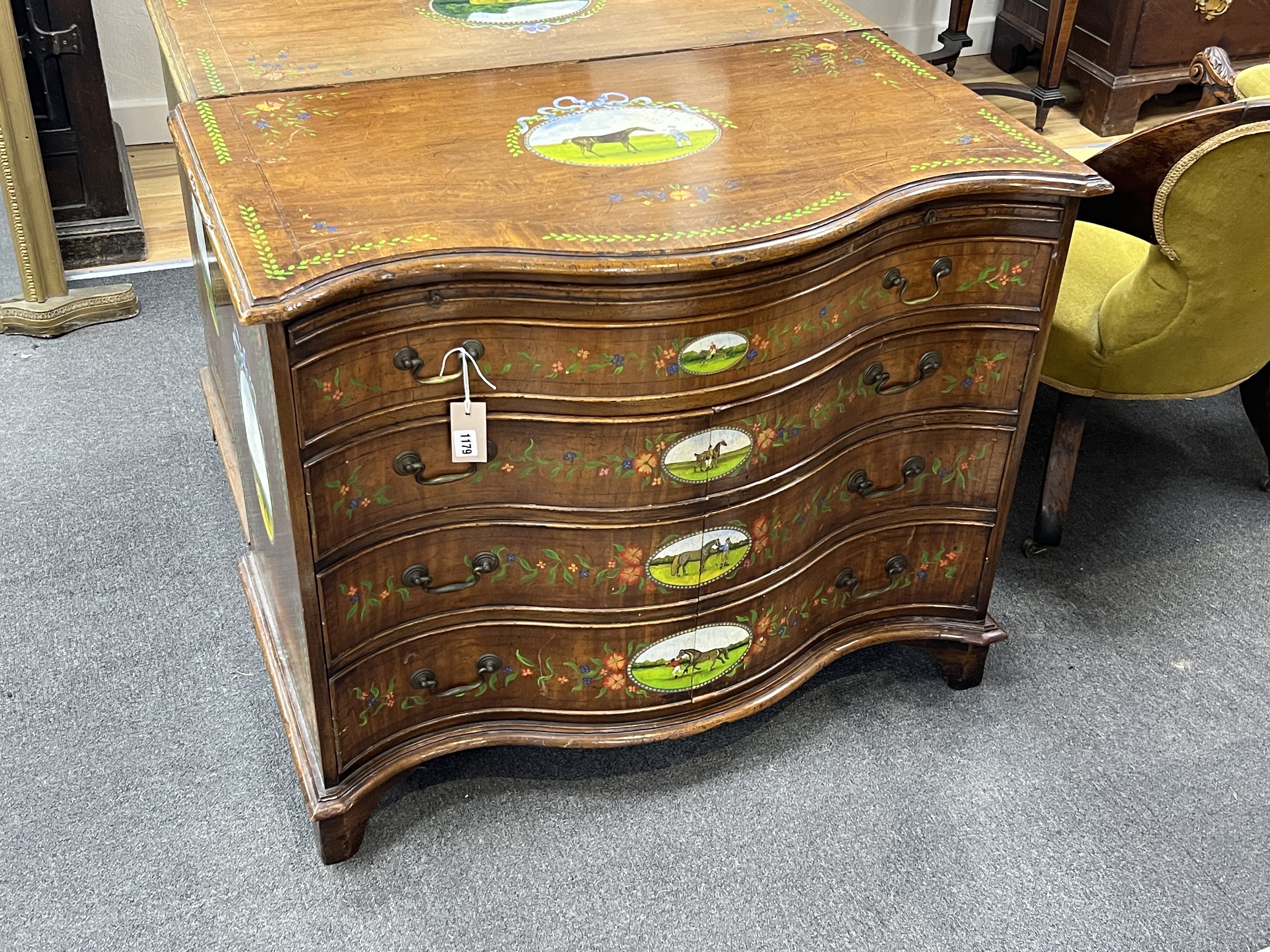 A George III style painted satinwood serpentine chest with part dummy drawer front, width 91cm, depth 48cm, height 75cm